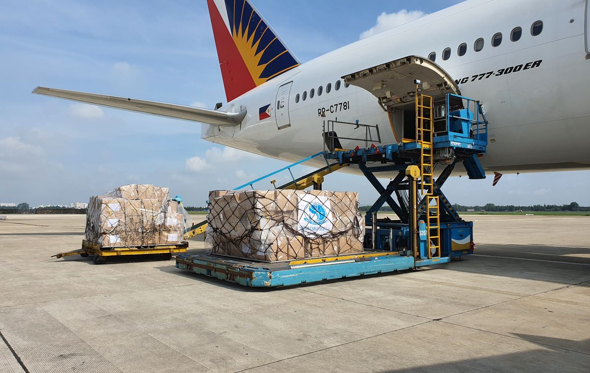 Air cargo pallets being loaded into an aircraft